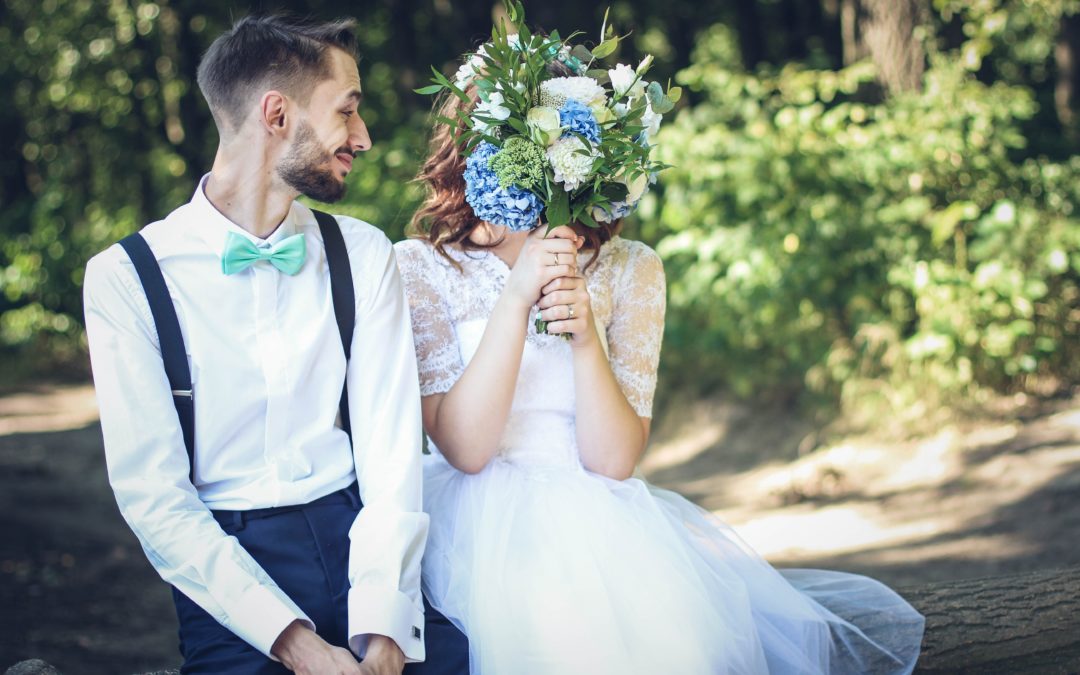 wedding bouquet hiding bride's face